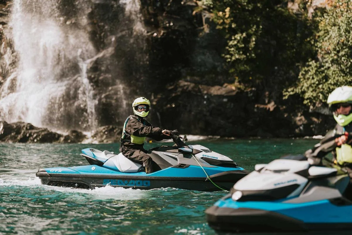 Jet skis near waterfall