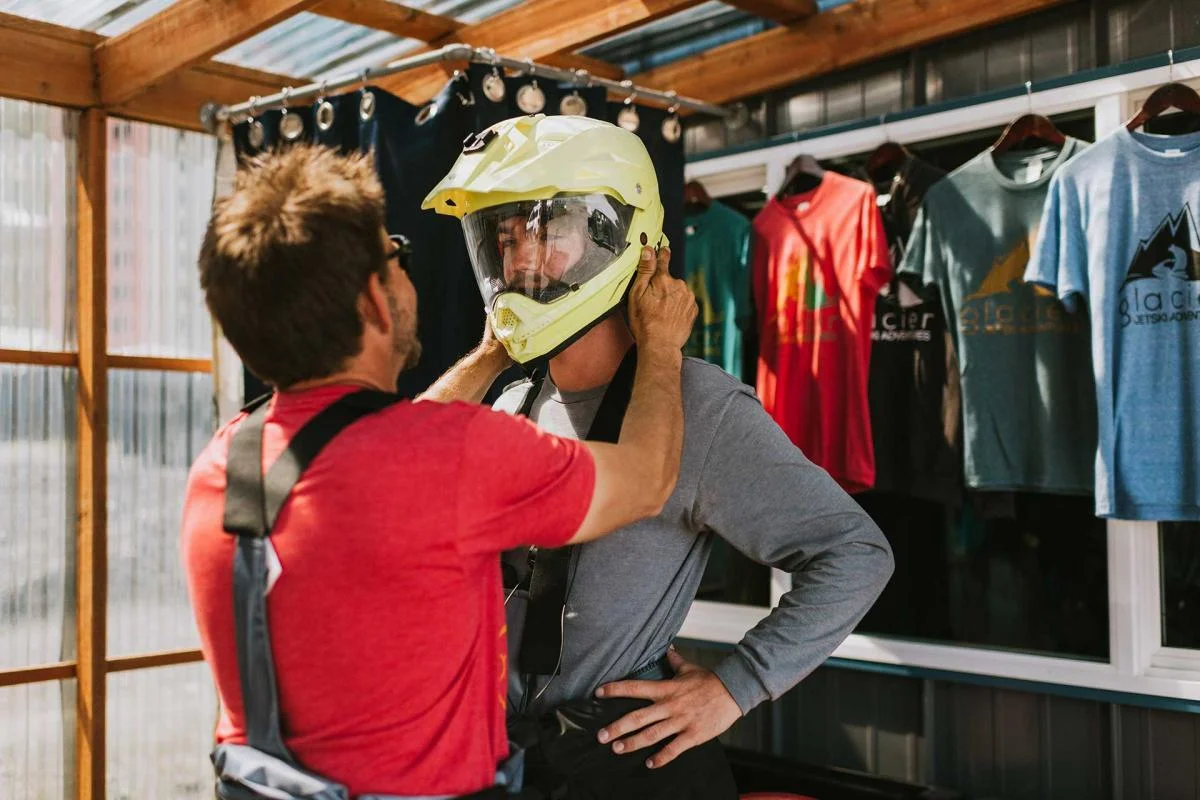 Staff helping with safety helmet