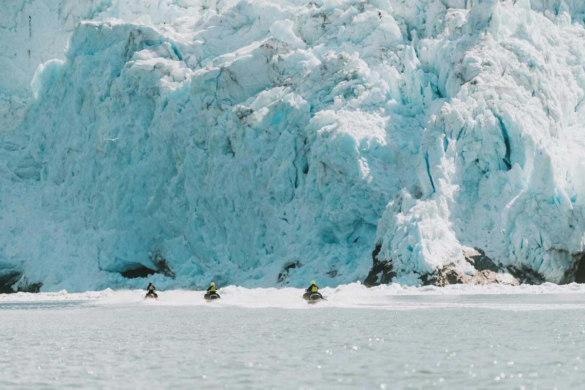 Three jet skis at glacier